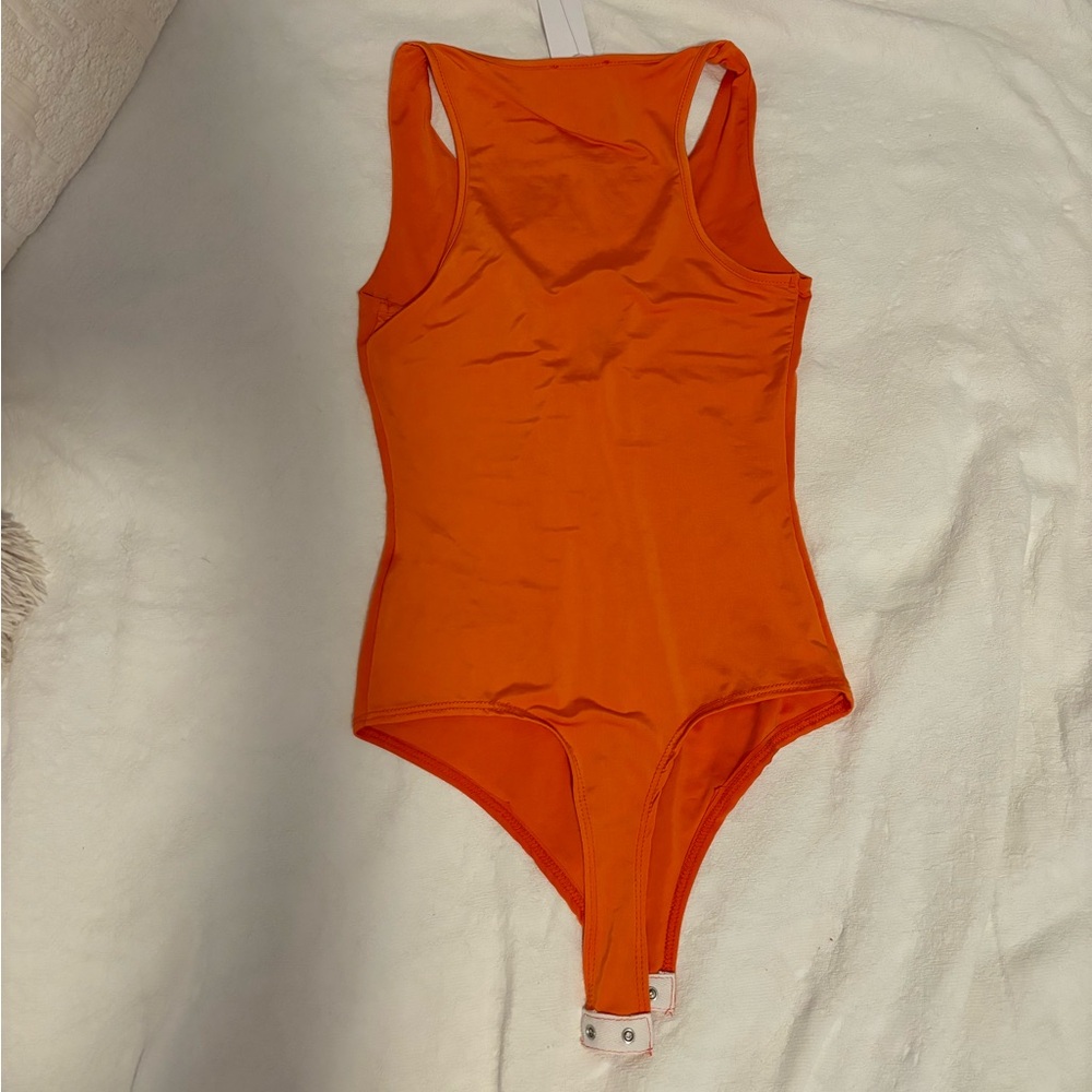 Xs orange body suit. Stretchy.